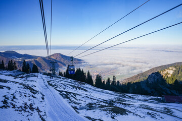 Cable car ride with the Kampenwandbahn to the mountain station on the Kampenwand, 1,461 meters above sea level. Panoramic view of Aschau im Chiemgau.