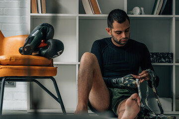 boxer putting on a boxing hand wrap