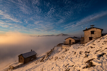 Como lake sunset over the clouds and mists, Alpe Ortighera, Valsassina, Lombardy