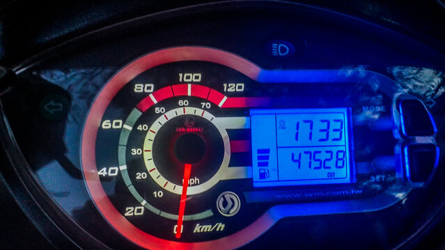 illustrative editorial SYM scooter dashboard, 150cc Motorbike speedometer odometer fuel indicator, trip counter RPM clock, 2 weal vehicle, selective focus, shallow depth, Cairo Egypt 26 Jan 2021