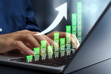 Sales increase and revenue growth in online shopping and e-commerce. Customer acquisition and demand generation. Businessman using laptop computer to analyze repeat purchases.