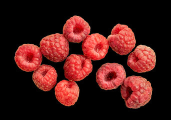 Red ripe raspberries isolated on black background, top view, macro.