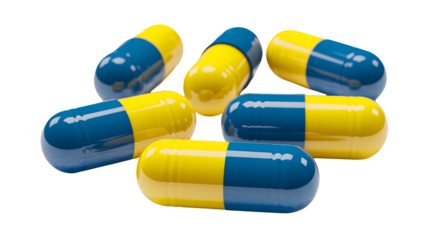 Blue and yellow capsules in scattered arrangement with glossy finish in bright studio lighting for pharmaceutical advertising