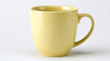 Simple yellow mug with bold color in a minimalist white setting