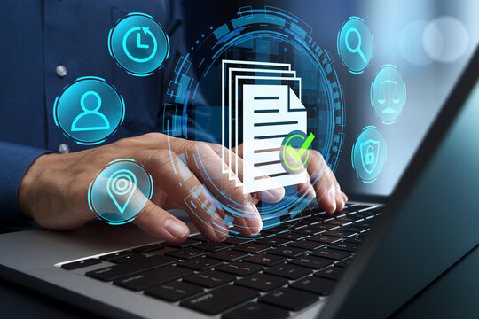 Legal document management. Compliance with audit trail and records management requirements. Document control and secure archiving. Businessman using laptop computer to store files.