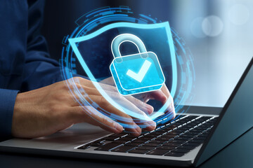 Data protection and cyber security. Secure VPN access and zero trust information security. Businessperson using laptop computer with an encrypted connection in network system.