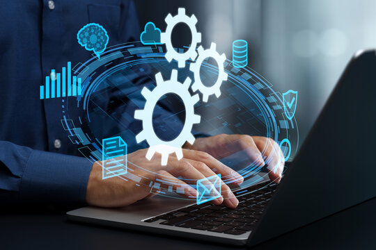 Automation of business process. Data integration and API automation solutions. Businessman using laptop computer to develop automated system.