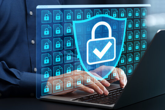 Information security and file encryption system. Secure data  storage. Businessman using laptop computer with data protection system.