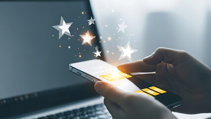 Person using smartphone with glowing stars and credit card for online shopping