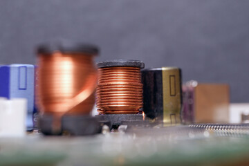 Copper inductor in high-tech electronic device. Using copper mines in technology.