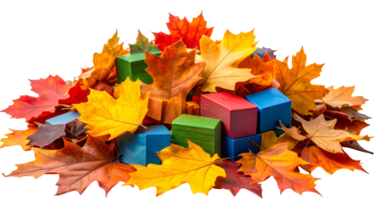 Colorful autumn leaves partially cover children's building blocks