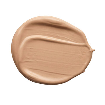 Round tan liquid foundation makeup swatch or concealer