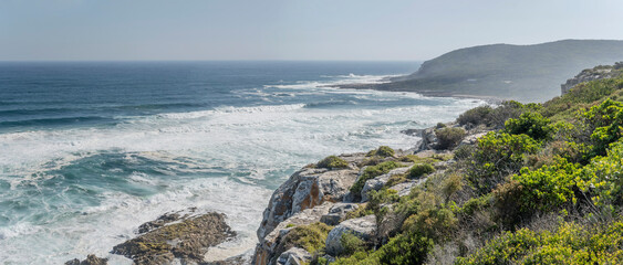 cliffs and Ocean waves froht west of  Robberg peninsula,  Plettenberg, South Africa