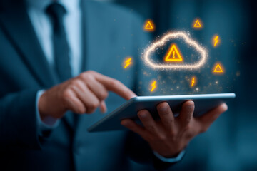 Cybersecurity and data protection concept: a businessperson in a suit interacting with a tablet that displays cloud and warning signs