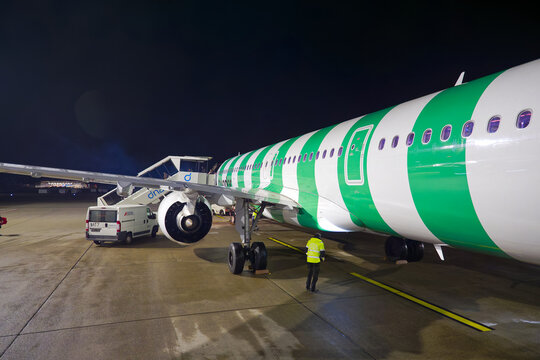 Passengers deboarding Condor airplane type Airbus A321neo registration D-ANMW at Swiss Z&uuml;rich Airport on an autumn evening. Photo taken November 22nd, 2025, Zurich, Switzerland.