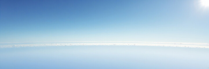 Obraz premium a serene and vast landscape with a clear distant horizon, the curved edge of the earth visible in the distance, set against a brilliant clear white sky with no clouds or obstructions, the atmosphere