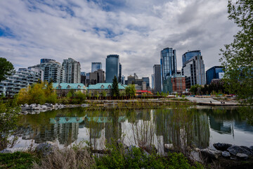 Modern skyline reflected in the Bow River in Calgary
