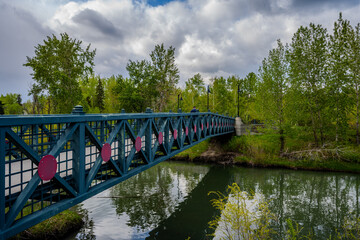 Footbridge over creek in urban park
