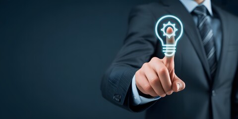 businessman touching digital lightbulb icon for innovation and creative ideas