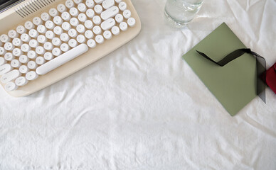 Styled scene of retro keyboard with envelope