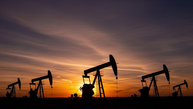 Pump Jack Oil Extraction Mining Machine at Petroleum  Fosil Fuel Energy Crude Oil Mining Field Industry Photo