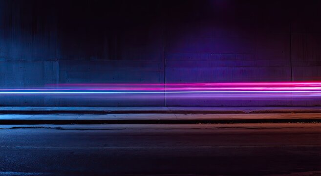 Long exposure captures blurred vehicle lights speeding across dark asphalt, tunnel