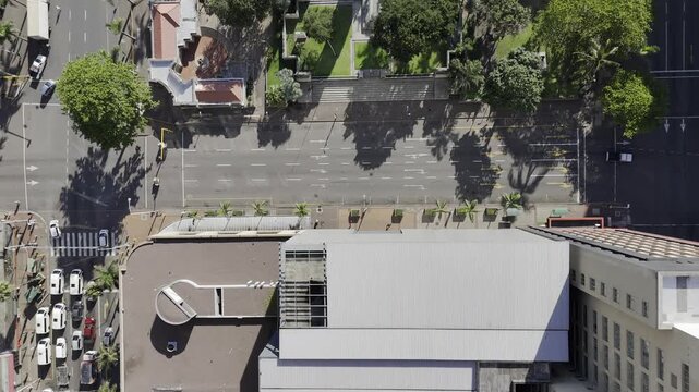 Drone flies east in bird's eye view over Farewell Square and City Hall on a sunny morning in downtown Durban, South Africa