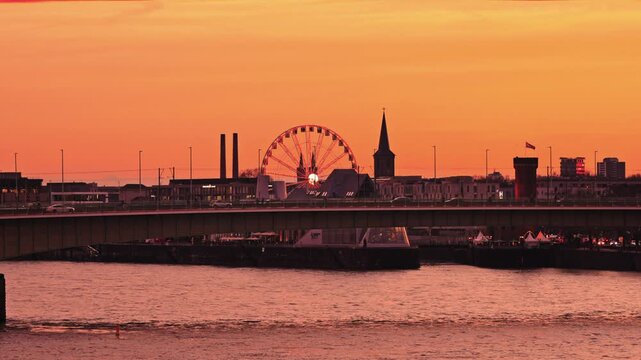 View from the Deutz side of the Rhine, featuring the 48-meter-high Ferris wheel installed at the Chocolate Museum for the holiday season.