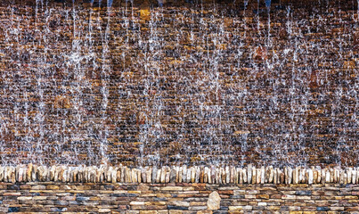 Stone wall background waterfall