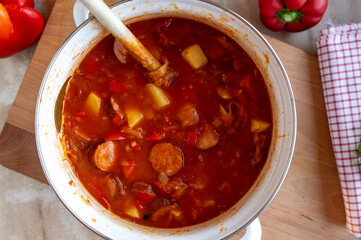 Sauerkraut Soup with sausage fresh and homemade cooked in a pot