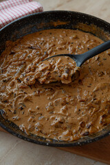 Delicious homemade brown, onion sauce in a skillet