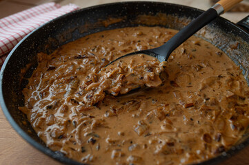 Delicious homemade brown, onion sauce in a skillet