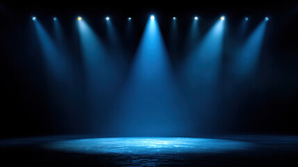 A dark stage area illuminated by multiple blue spotlight beams, creating a dramatic, empty performance space ideal for theater, concerts, or presentations.