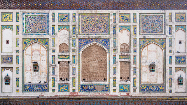 Detail of colorful mosaic decoration on historic Picture Wall built by mughal emperor Jahangir in fort, Lahore, Punjab, Pakistan 