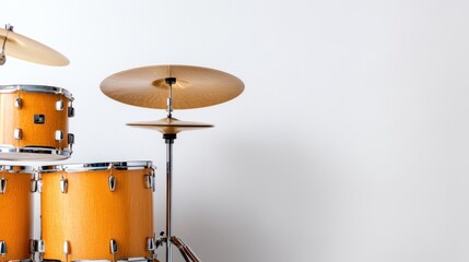 Percussion drum set with vibrant yellow finish showcased in studio setting
