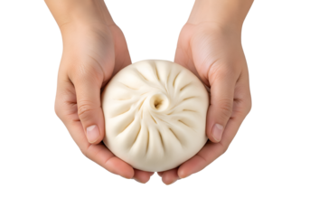 Hands holding stuffed steamed bun top view isolated on transparent background