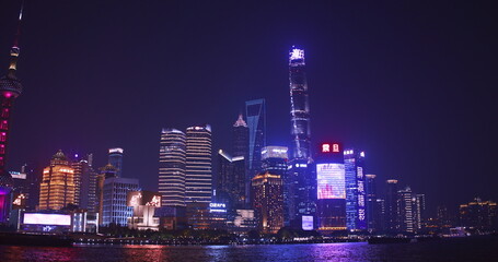 Nighttime of Shanghai Skyline Showing Brilliant Colors on Water Reflections