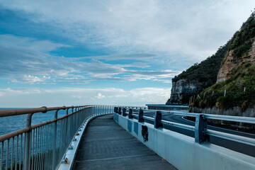 Photo taken at Sea Cliff Bridge in December 2025, showing the iconic coastal bridge and ocean views, with people enjoying walking and sightseeing along the coast.