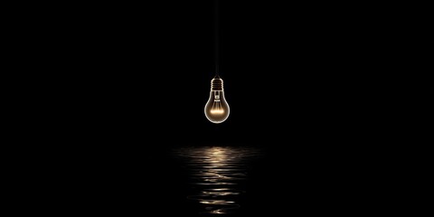 Glowing lightbulb suspended in darkness over a reflecting surface, creating a minimalist ambiance