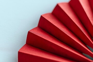 Red pleated paper fan symbolizing chinese new year celebrations and traditional asian culture concept
