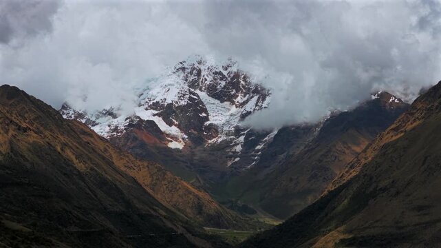 Mount Humantay Salkantay Peru aerial drone high altitude Peruvian Andes snow capped glacier peaks Laguna Humantay Lake landscape dry season cloudy sunny morning Anta province circle right parallax