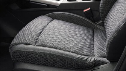 Medium shot of warp knit fabric applied on automotive seat covers highlighting intricate texture and durability for vehicle interior comfort.
