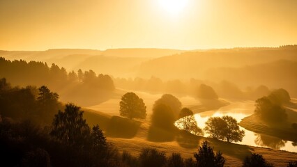 Golden sunrise over misty landscape river.