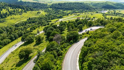 Winding mountain road through Oituz Pass, Romania
