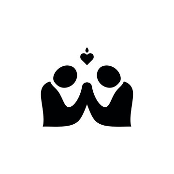 Two people holding hands with a heart above them symbolizing love and connection.