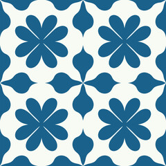 Fototapeta premium Vector seamless pattern featuring four-petal blue flowers and abstract leaf shapes on a clean white background