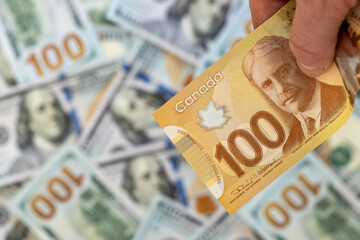 Money in Canada. Currency exchange rate. Canadian dollar vs US dollar. Value of Canadian currency. Economic and financial concept. Business background. Close up