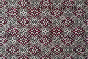 Traditional Anatolian textile pattern with repeating geometric floral motifs, showcasing detailed woven fabric and cultural ornament design