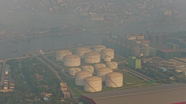 Aerial view of Dhaka port facility with petrochemical containers and oil storage in Bangladesh