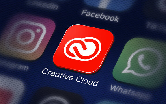Creative Cloud logo on the digital screen